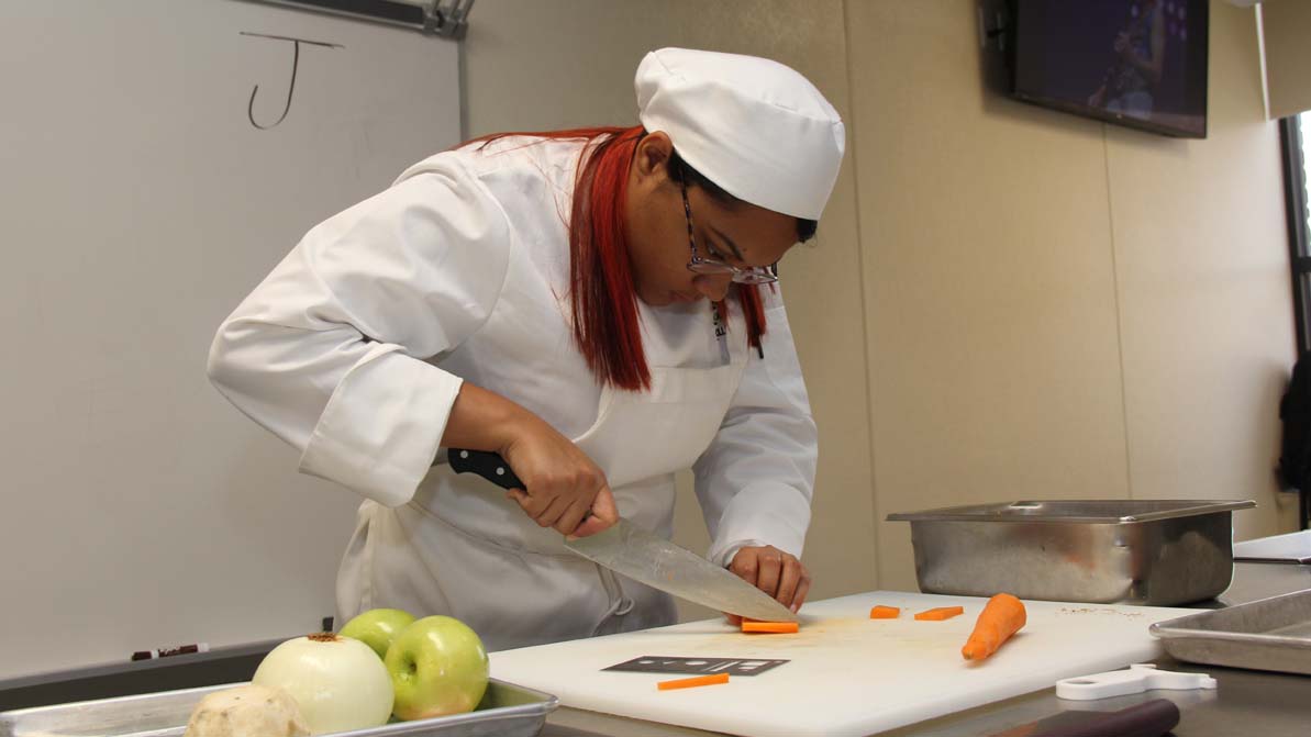 A culinary arts 첥 chops carrots in the 첥 MGM Culinary Arts Institute